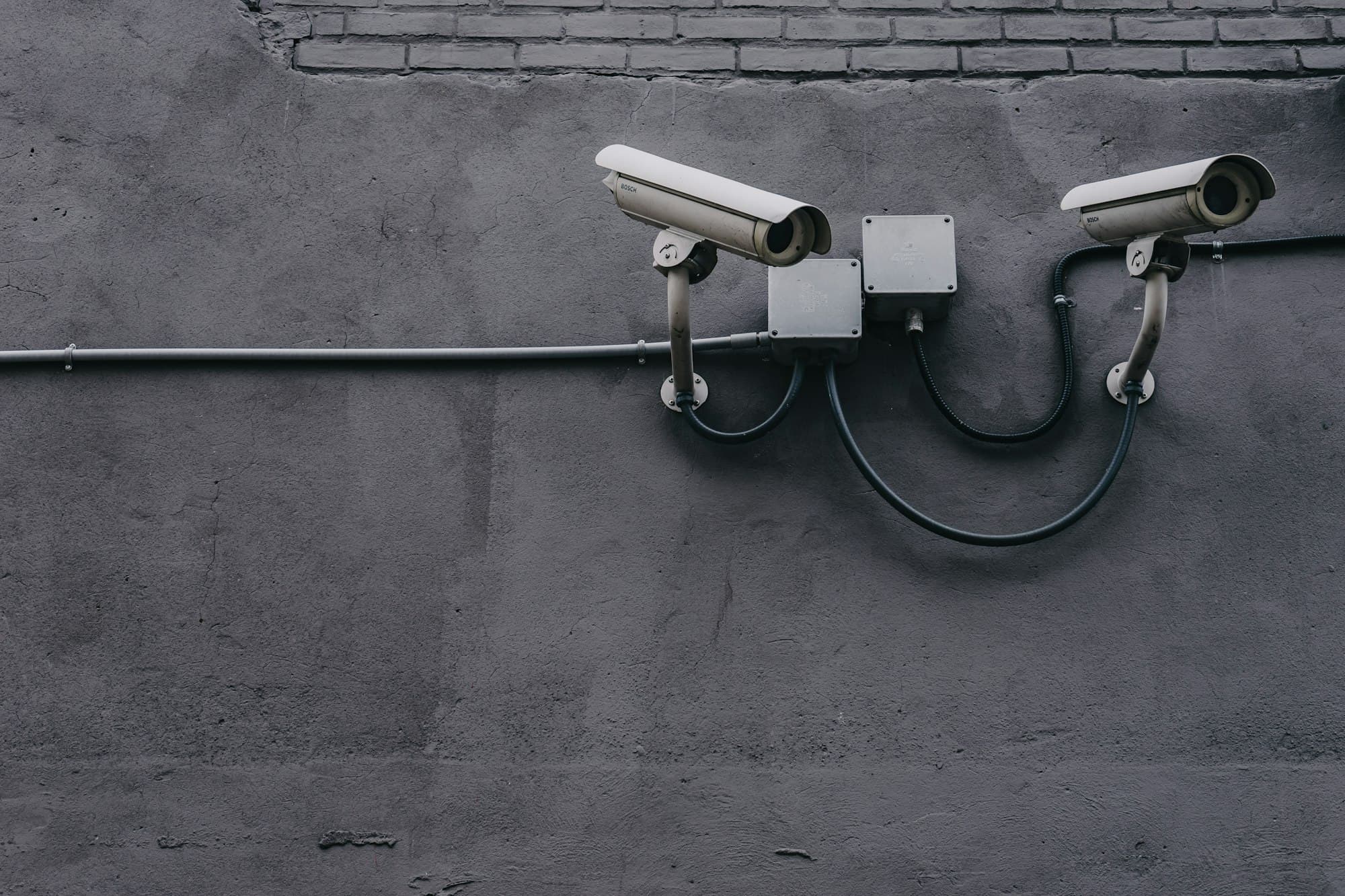 Bullet security cameras mounted for facility surveillance